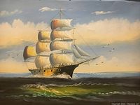 Close-up of framed oil painting showing the sailing ship at sea, highlighting sail and sky details