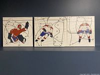 Full view of trio of hockey player prints on stretched canvas with game plan sketch backgrounds.