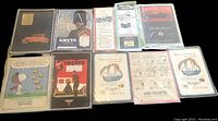 Overview of all 10 vintage advertising cards laid out showing various themes including Snoopy, Ford Falcon, Greys, Simplex, Wright's, and Metropolitan Life.