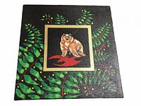 Front view of the acrylic painting showing the bear, foliage, and gold frame on a black background.