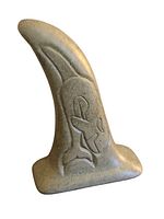Front view of the concrete statue showing the embossed killer whale on the front, shaped like a fin or tail.