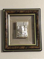 Frontal view of framed silver 3D Jerusalem art piece showing the entire frame and mounted plaque.