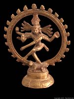 Front view of vintage brass Shiva Nataraja statue showing detailed arms, headdress and circular ring of fire.