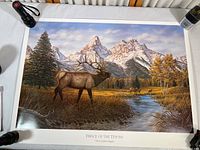 Full view of the elk poster displaying the entire print titled 'Prince of the Tetons' depicting the elk and mountain scenery, laid flat for inspection.