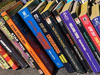 Photo showing front row of Star Trek and associated sci-fi books, titles visible include 'Star Trek Log Two', 'Enterprise', and 'Crossroad'.