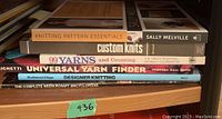 Side view of six knitting books stacked including titles and authors visible.