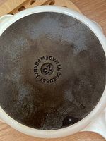 Bottom of white skillet showing MADE IN FRANCE LE CREUSET marking