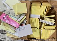 Box of assorted Post-it notes including yellow, pink, branded Microsoft and 3M pads
