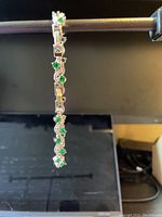 Sterling silver bracelet hanging vertically showing CZ stones pattern