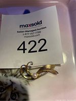 Front view of Edouard Nahim vintage Sterina brooch showing swirl and leaf design with pearl accent