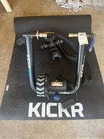 Full view of Kickr Snap trainer assembled on branded foam mat