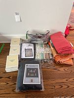 Overview of all quilt kits, fabric bundles, yardage and pillow covers arranged on floor