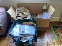 Box and tote bag filled with paper pattern envelopes