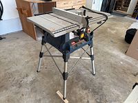 Front-side view of Ryobi table saw on folding stand