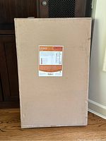 Box of Linear Wall Mounted Towel Warmer showing product label with specifications and branding.