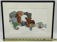 Full front view of framed watercolor painting with measuring tape showing frame width.