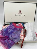 Talbots box containing multiple colorful scarves of various patterns and textures