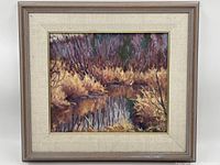 Full view of framed oil on panel marshland painting
