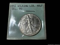 1942 Walking Liberty half dollar coin in plastic holder marked 1942 WALKING LIB. HALF SEL. BU. Shows the obverse with Liberty walking and rising sun visible with clear details.
