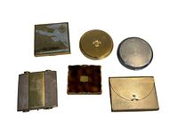 Photo of six vintage makeup compacts arranged in white background with a baseball for scale (not included).