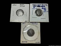 Photo of three U.S. dimes in cardboard holders labeled with year, type, and condition: 1821 Bust Dime (AG), 1939-D Mercury Dime, and 1857 Liberty Seated Dime (Fine).