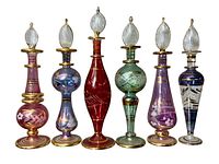 Front view of six hand blown glass perfume bottles showing colors, shapes, and decorative detailing with gold accents