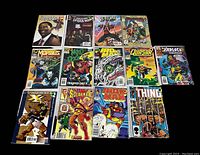 Display of 13 Marvel comic books with visible cover titles and artwork for identification.