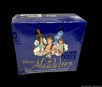 Front view of factory sealed Disney's Aladdin Skybox trading card box showing characters and branding.