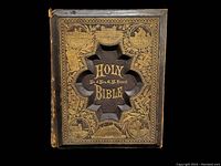 Front cover close-up showing gold embossed artwork and cross cut-out with title and inscription