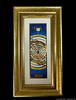 Full view of the framed artwork showing narrow vertical zodiac-themed print in a gold-tone hammered frame with beaded inner detailing.