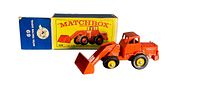 Lesney Matchbox #69 Hatra Tractor Shovel toy with original box, showing the toy and the box side by side.