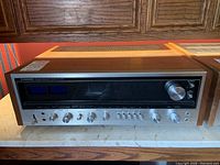 Angled front view showing overall appearance and wood veneer case