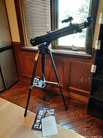 Assembled Meade StarNavigator telescope on tripod showing optical tube and finder