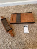 Top-down view of the antique pill roller showing wood and metal construction with visible wear.