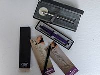 Lot contents showing three pens in original boxes and packaging, including documentation from Sheaffer and Parker.