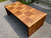 Full angled view showing checkerboard parquet top and U-shaped sides