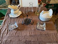 Overview of all items on table showing the complete set of vintage ceramic and glassware including candle holders