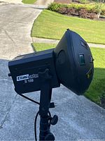 Side view of the Eliminator E109 lighting fixture showing brand label and side ventilation.