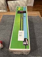 Box showing front and side image of Gibraltar Industrial metal mailbox with post, including product information and model number T111KT08.