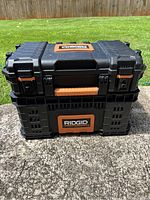 Front view of Ridgid tool chest showing two stacked compartments and orange logo.