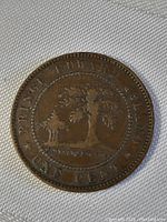 Reverse side of the 1871 Prince Edward Island penny coin showing tree design with Prince Edward Island and one cents text.