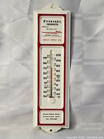 Full view of the vintage Eveready advertising thermometer showing entire front face with temperature scale and company branding.