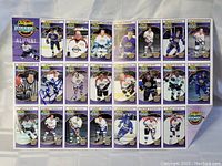 Photo of old-timers hockey cards set showing multiple legendary players including Bobby Hull with autograph.