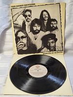 The vinyl LP disc with Warner Bros. Records label visible, showing the record surface to assess condition.