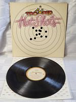 Vinyl disc from The Trooper Hot Shots album showing record label and surface condition.