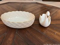 Two-piece set shown with oval bowl and swan figurine on wooden table, illustrating size and condition.