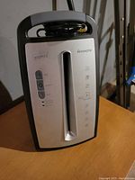 Front view of Staples Minimate paper shredder showing control buttons, paper feed slot and brand labels