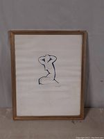 Full view of signed framed print featuring nude figure in a modern blue line style, visible frame and matting.