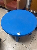 Top view of the blue round kids table showing surface and legs