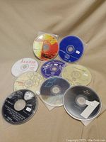 10 jazz compilation CDs laid out on beige surface, showing disc artwork and varying jazz themes.